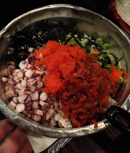 The fixins for fried rice include fish roe, seaweed,  and more octopus.