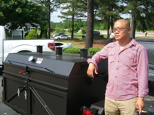 Tyson and his new hog cooker, Fat Sally.
