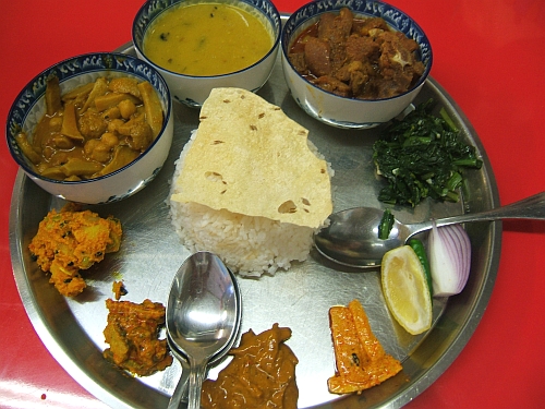 Vegetable curry, daal, goat curry, and pickles make up Dhaulagiri’s amazing Ambassador Thali. 