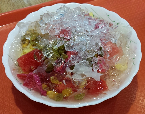 Bing fan is topped with ice, mixed fruit, and cloud ear fungus. 