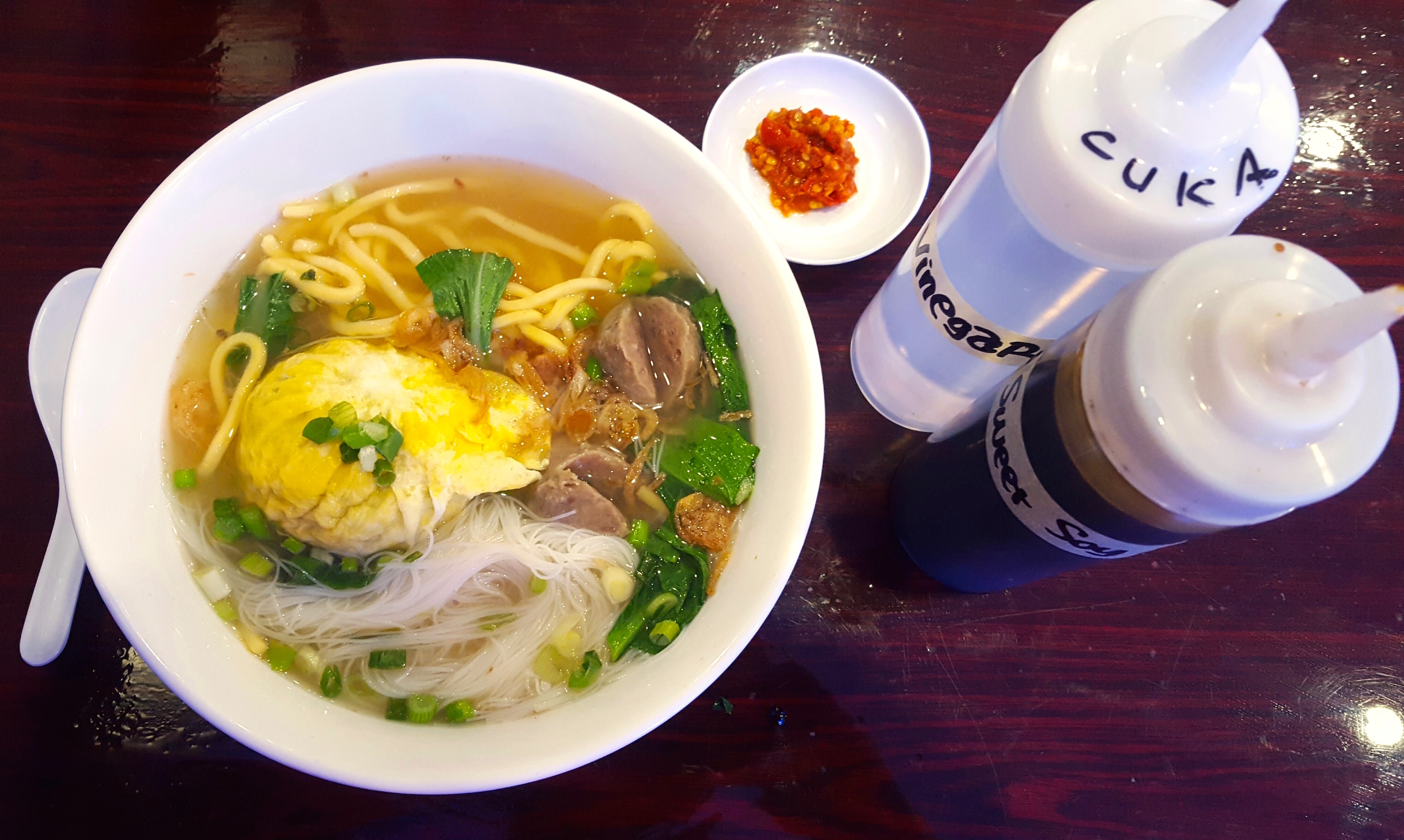 Bakso kabut features a giant meatball shrouded in a fried egg. 